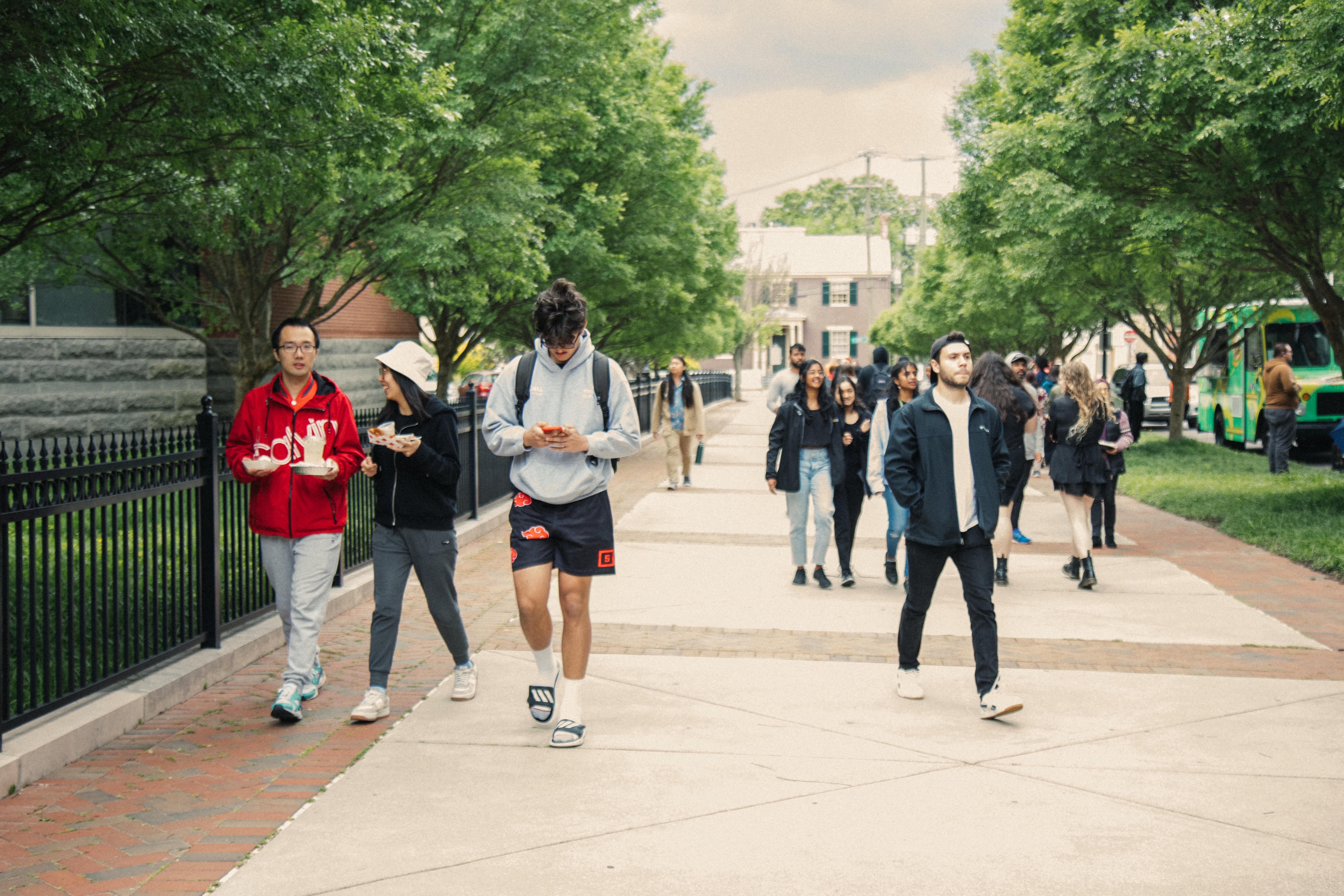 students walking down the sidewalk